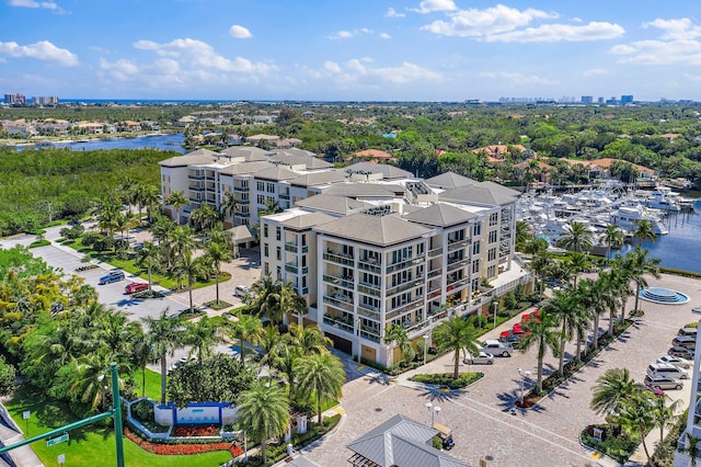 birds eye view of property with a water view