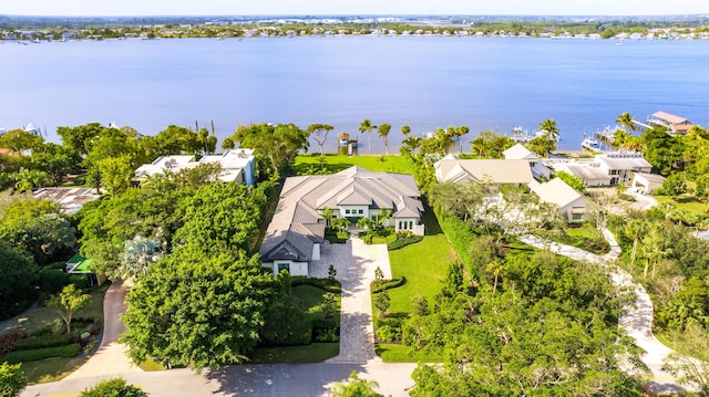 birds eye view of property with a water view