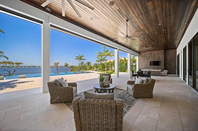 81 S River Rd, Stuart, FL 34996 - view of patio / terrace with an outdoor pool, a ceiling fan, and an outdoor hangout area