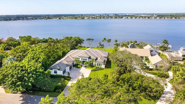 birds eye view of property with a water view