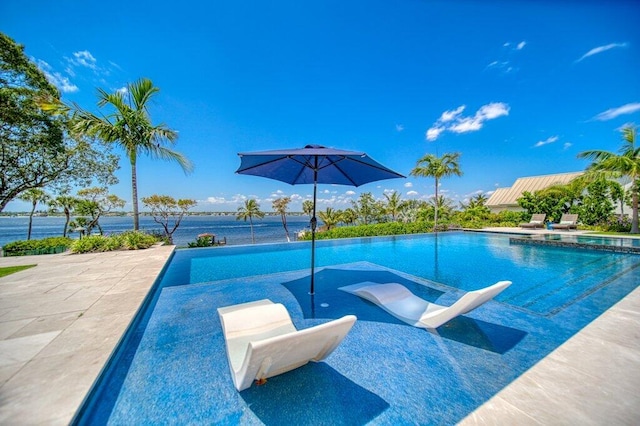 81 S River Rd, Stuart, FL 34996 - view of pool featuring a pool with connected hot tub and a patio