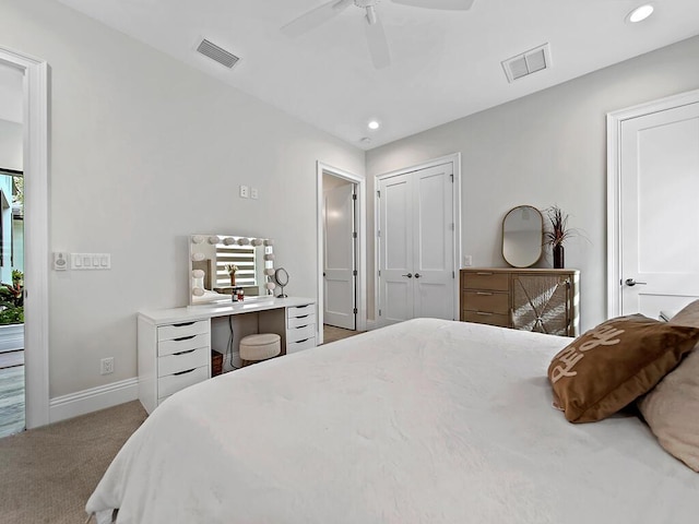 bedroom with light colored carpet and ceiling fan