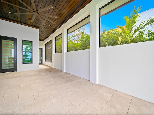 unfurnished sunroom featuring wooden ceiling