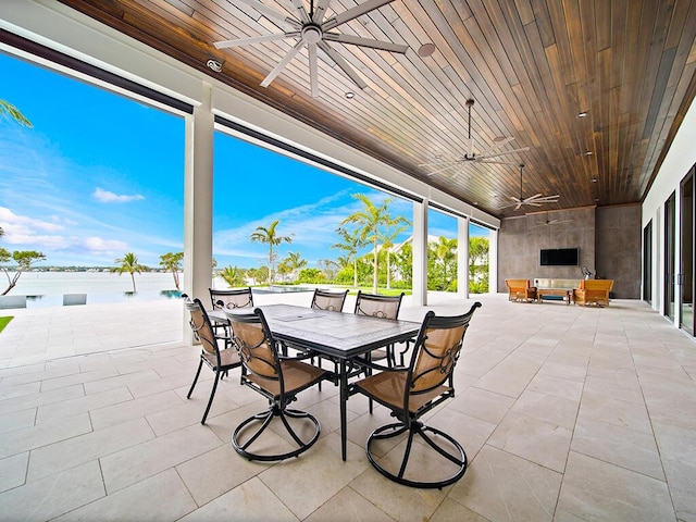 view of patio / terrace with an outdoor living space and ceiling fan