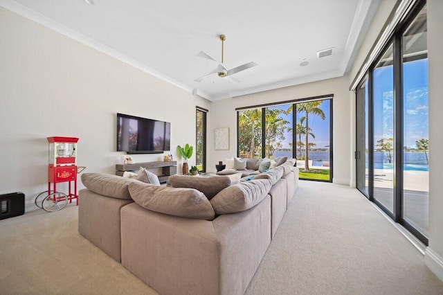 81 S River Rd, Stuart, FL 34996 - carpeted living room with ornamental molding, visible vents, a wealth of natural light, and ceiling fan