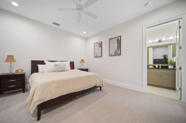 81 S River Rd, Stuart, FL 34996 - bedroom featuring baseboards, recessed lighting, ensuite bathroom, visible vents, and light colored carpet