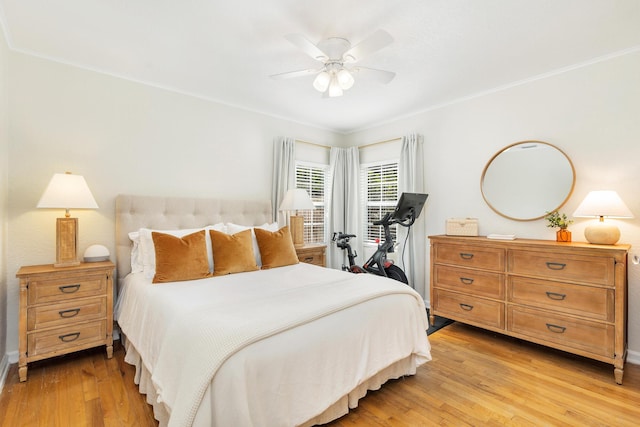 bedroom with crown molding, ceiling fan, and light wood-type flooring