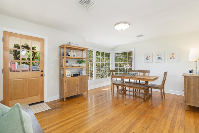 dining space with light wood-type flooring