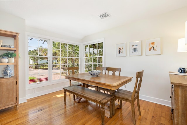 dining space featuring light wood-type flooring