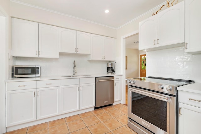 kitchen featuring stainless steel appliances, white cabinetry, sink, and ornamental molding