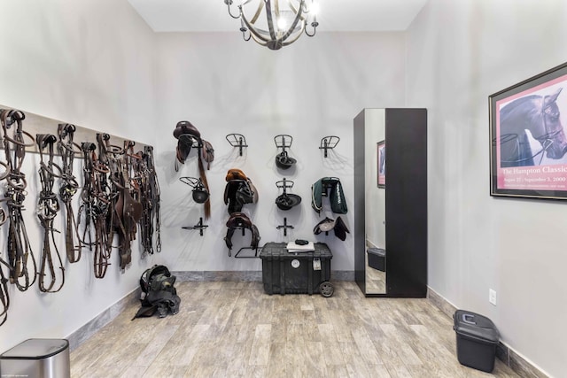 interior space with an inviting chandelier and hardwood / wood-style flooring