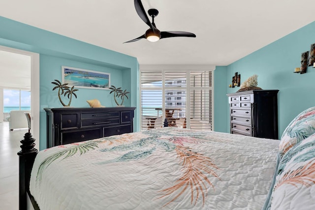 bedroom with ceiling fan and multiple windows