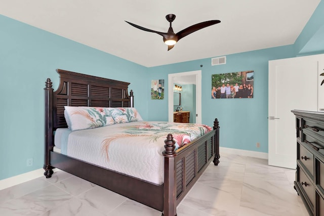 bedroom with ensuite bathroom and ceiling fan