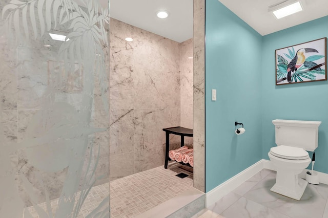 bathroom with tiled shower and toilet