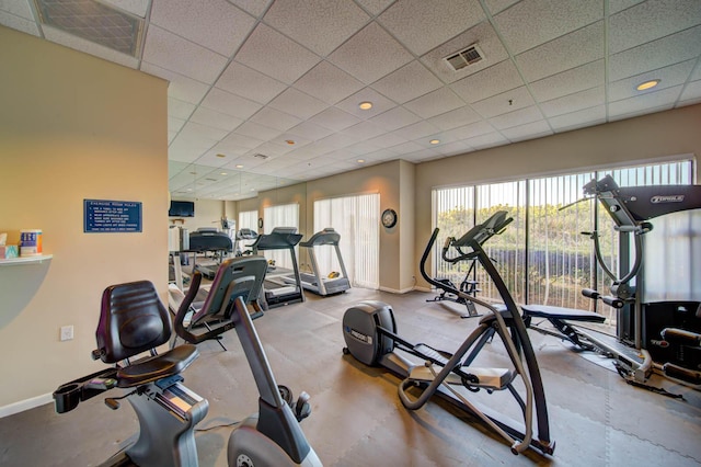 workout area with a paneled ceiling