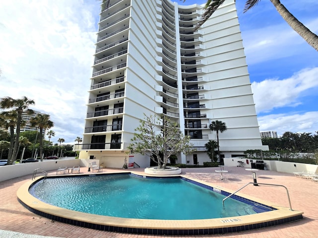 view of swimming pool with a patio area