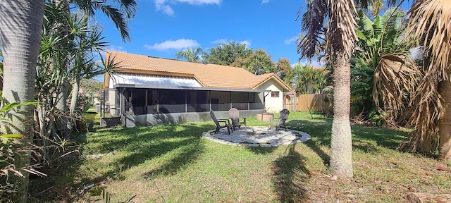 view of yard featuring a patio and a sunroom