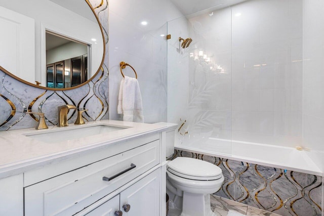 full bathroom with tiled shower / bath, vanity, and toilet