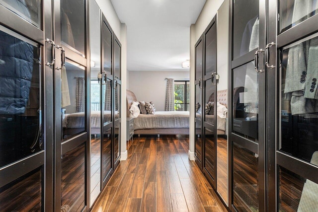 bedroom with dark wood-type flooring