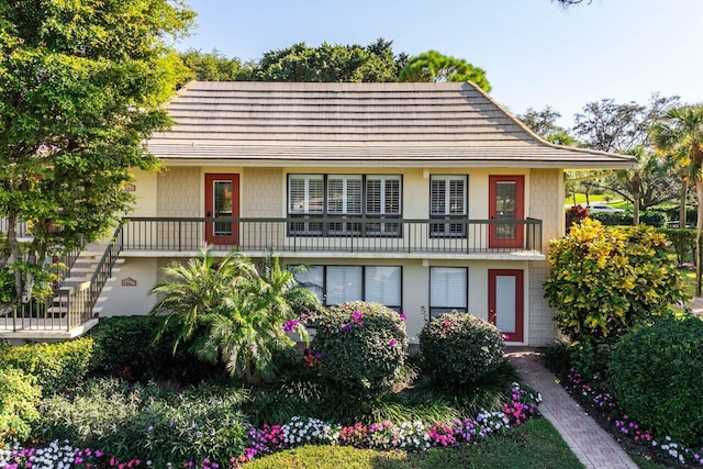 view of front of house featuring a balcony