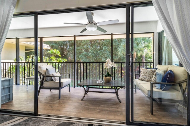 sunroom with ceiling fan and plenty of natural light