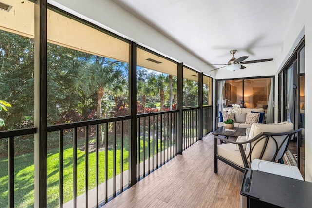 sunroom / solarium with ceiling fan