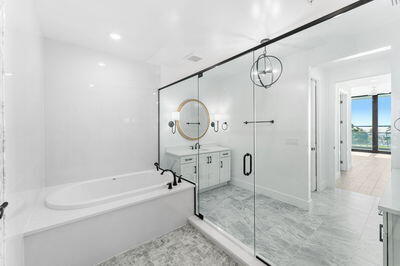 bathroom with vanity and separate shower and tub