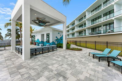 view of property's community with an outdoor hangout area and a patio