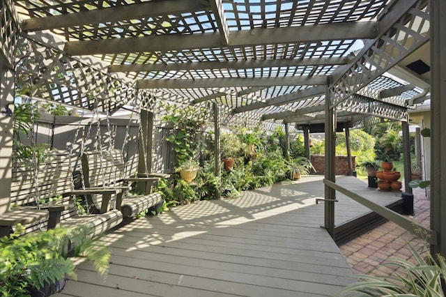 wooden deck featuring a pergola