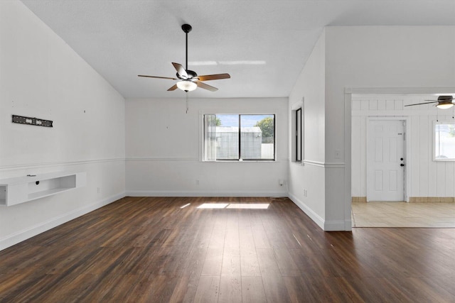 interior space featuring a textured ceiling, dark wood-type flooring, and ceiling fan