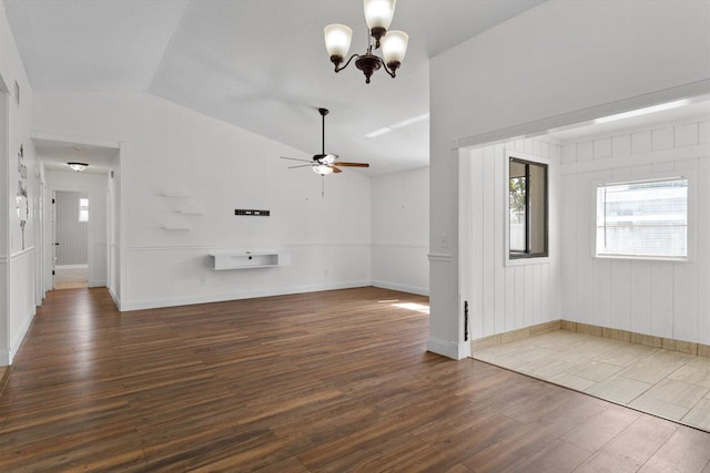 unfurnished room with lofted ceiling, dark hardwood / wood-style floors, and ceiling fan with notable chandelier