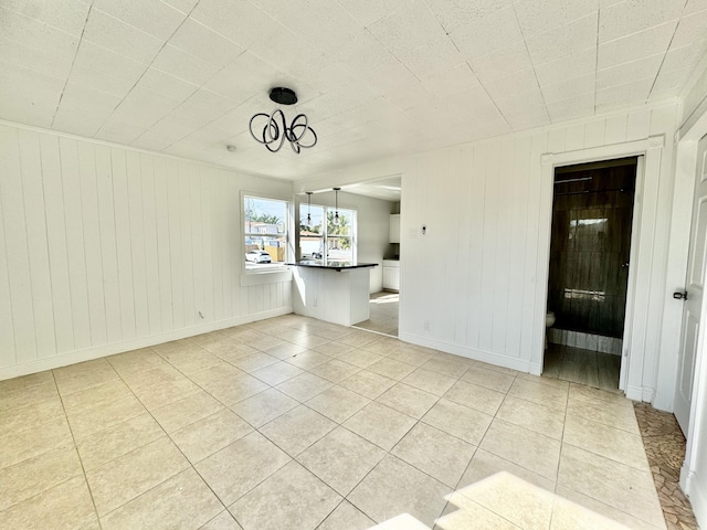 unfurnished room with light tile patterned floors