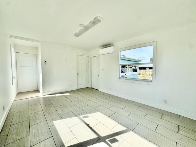 spare room with a wall mounted air conditioner