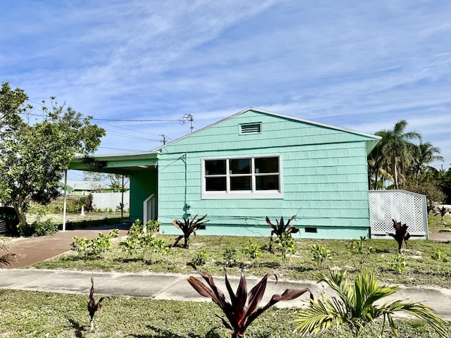 view of front of property with a carport