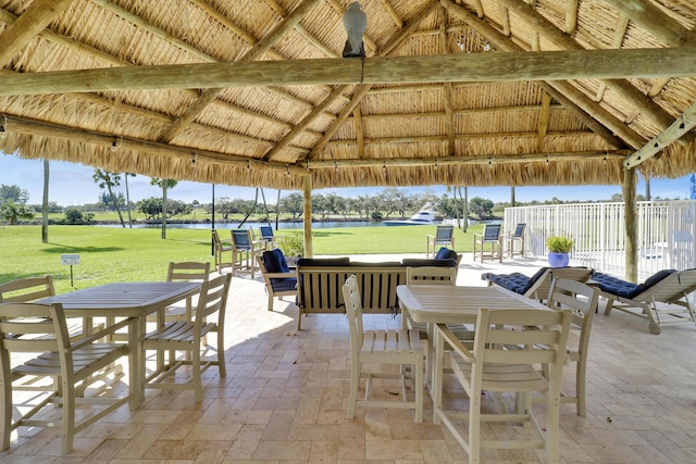 view of patio / terrace with a gazebo and a water view