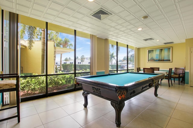 playroom with light tile patterned floors, a wall of windows, and billiards