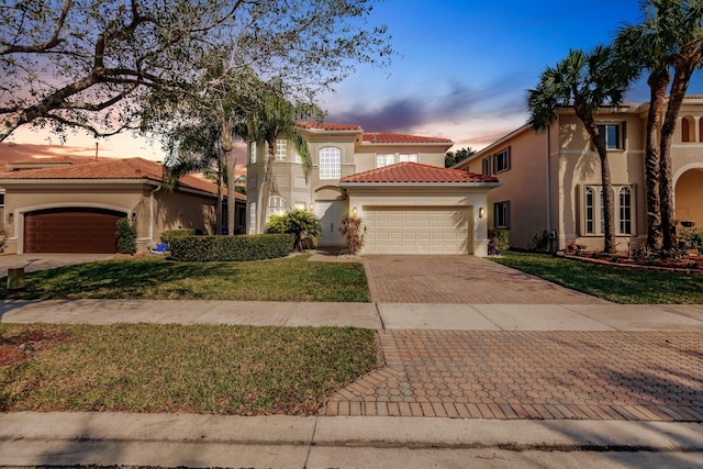 mediterranean / spanish-style house featuring a lawn