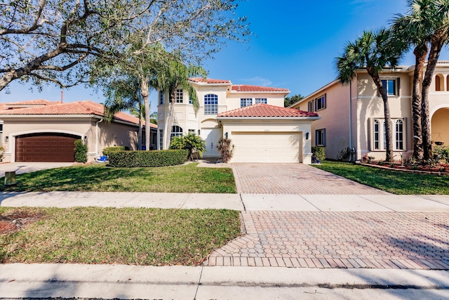 mediterranean / spanish-style house with a front yard