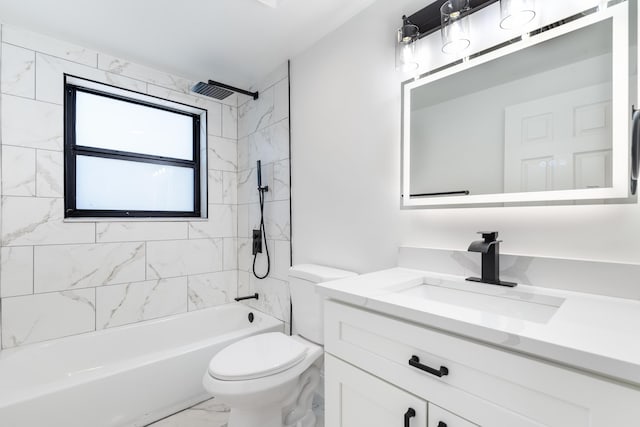 full bathroom featuring tiled shower / bath combo, vanity, and toilet