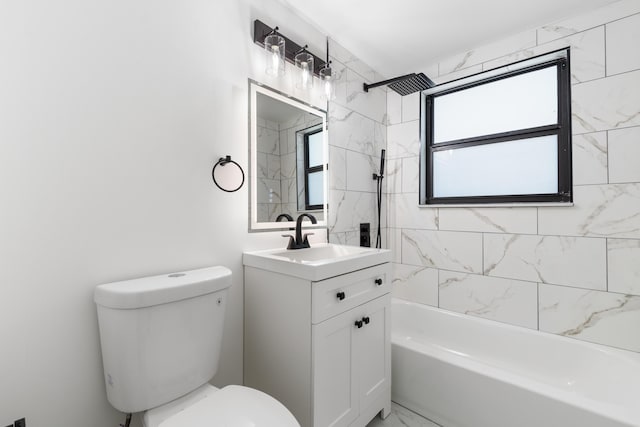 full bathroom with vanity, toilet, and tiled shower / bath