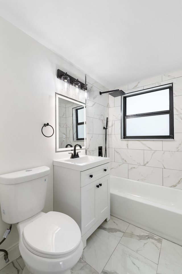 full bathroom with vanity, tiled shower / bath combo, and toilet