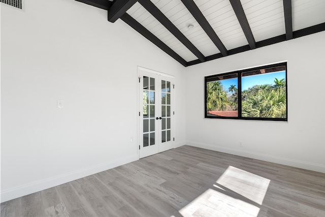 empty room with french doors, high vaulted ceiling, light wood-type flooring, and beamed ceiling