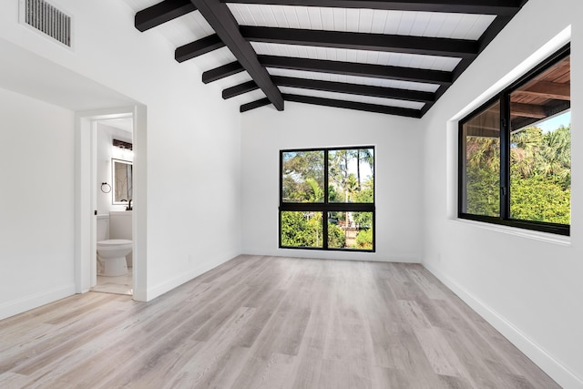 spare room with wood ceiling, light hardwood / wood-style floors, and vaulted ceiling with beams