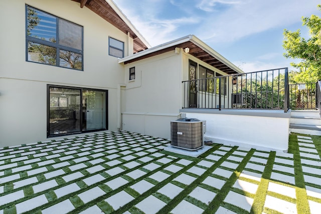 exterior space featuring a patio area and central air condition unit