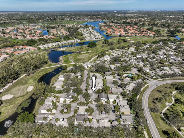 aerial view of residential area with a large body of water and a local golf course