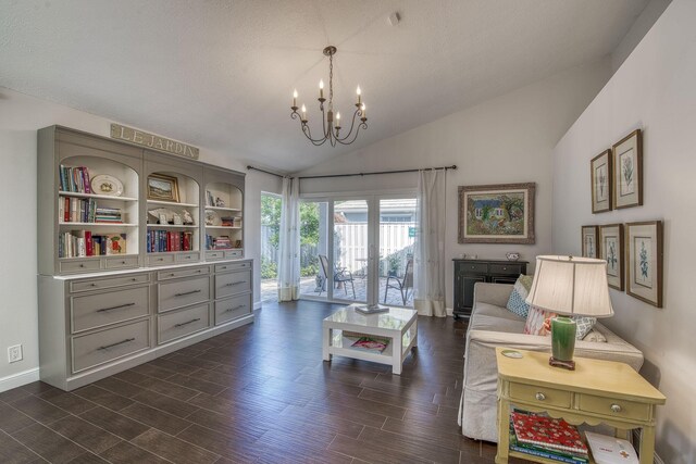 sitting room with a chandelier, dark wood finished floors, vaulted ceiling, and baseboards