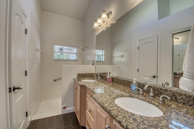 full bathroom featuring walk in shower, double vanity, and wood finish floors
