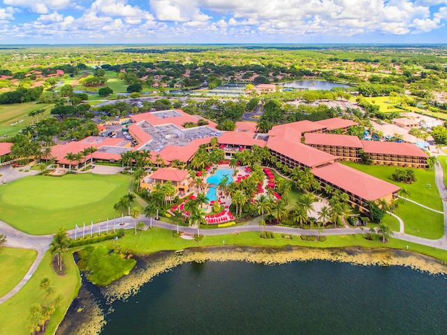 aerial view of a large body of water, a golf course, and a pool