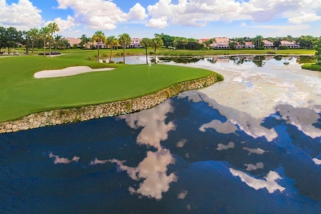 view of community with a water view, a putting area, and golf course view