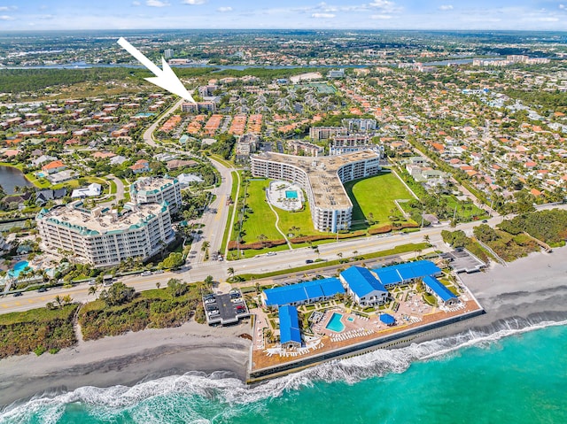 aerial view featuring a water view and a view of the beach